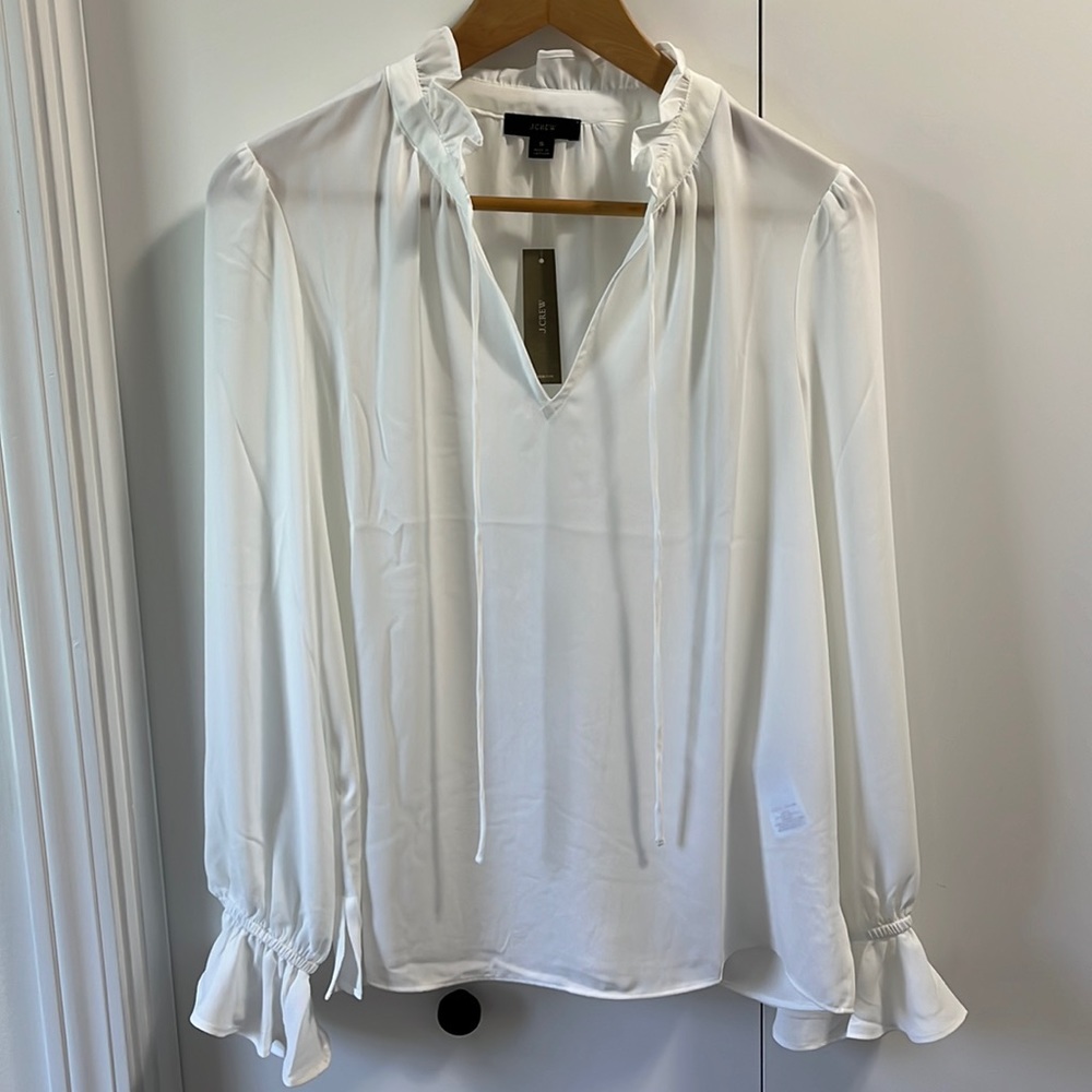 Woman’s J.Crew white sheer blouse with ruffle detail, small, new with tags.